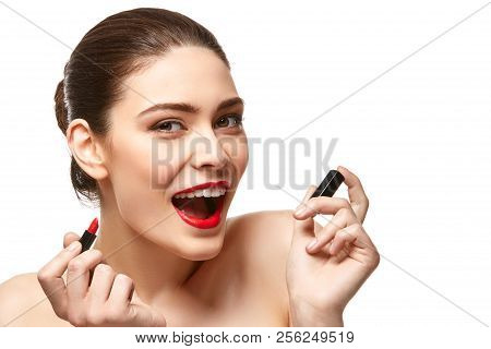 Girl Applying Red Lipstick Isolated On White