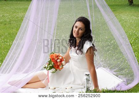 Gentle Bride With A Bouquet In A Pink Tent In The Park