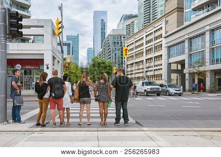 Toronto,canada-august 3,2015:people Stroll In The Central Street Of Downtown Toronto On A Sunny Day