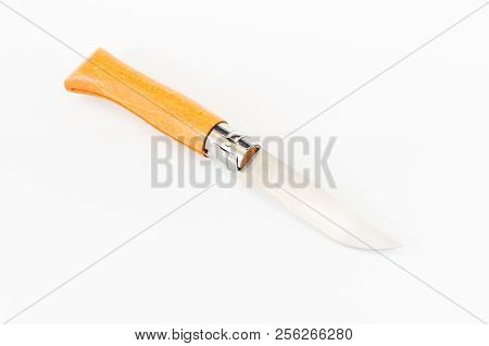 A Knife With A Wooden Handle. A Classic Knife. The Knife Lies Diagonally.