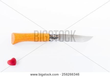 Knife And Heart On White. Passion For Knives. Isolate