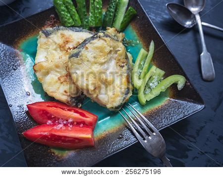 A Useful Breakfast Of Fried Cod And Fresh Vegetables
