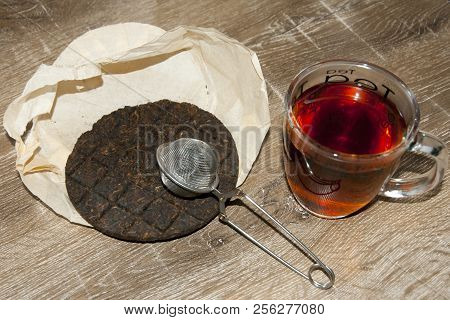 Organic Chinese Puer Tea On Wood Table