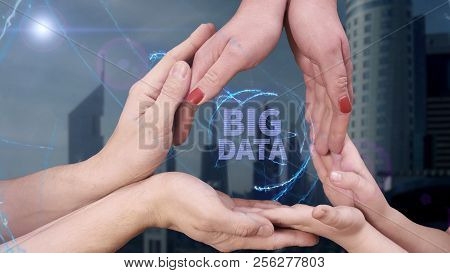 Men's, Women's And Children's Hands Show A Hologram Big Data