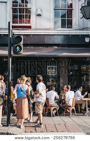 London, Uk - July 24, 2018: People Drinking Outside The Old Crown Pub On New Oxford Street, London. 