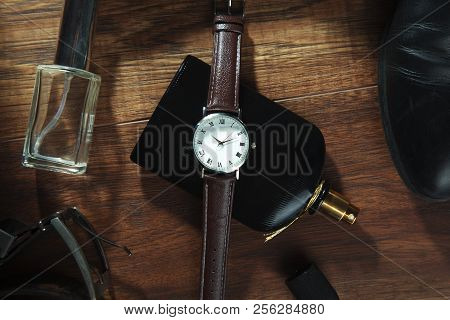 Man Elegant And Different Accessorise On Wooden Background