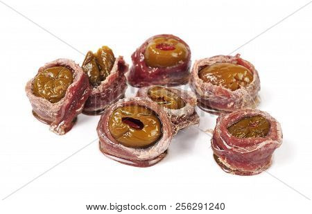 Anchovy Fillets Stuffed With Olives And Pepper Isolated Over White Background