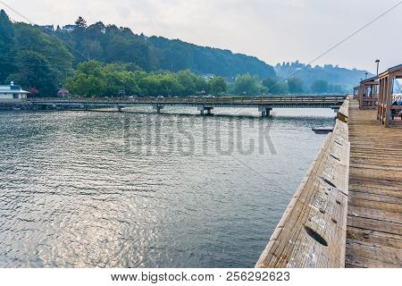 Smoke From Fires Creates A Haze Over A Pier And The Shoreline In Ruston, Washington.