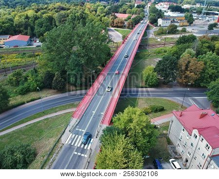 Aerial view on intersection of railroad and car road in city