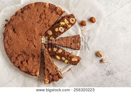 Italian Dessert Panforte With Nuts, Chocolate And Candied Fruits. White Background, Top View, Italia