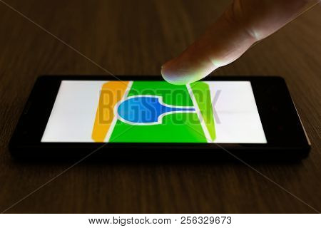 Moscow, Russia - August 19, 2018: A Smartphone Lying On A Table In The Dark, Displaying The Logo Of 