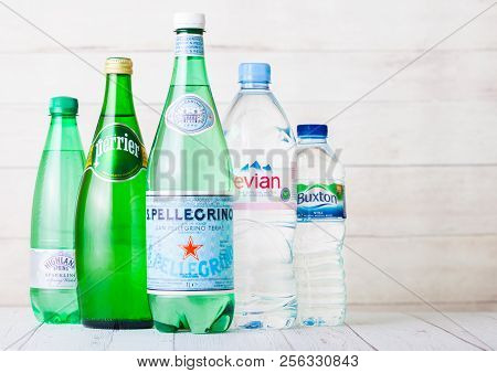 London, Uk - September 03, 2018: Bottle Of Evian Perrier And Sanellegrino Water On Wood. Made In Fra