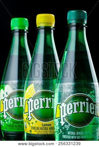 London, Uk - September 03, 2018: Bottles Of Perrier Sparkling Water On Black Background. Perrier Is 