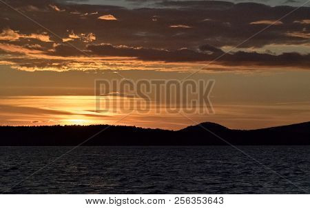 Golden Sun Sinks Over The Lake In The Evening, Golden Water, South Ural Lake Uvildy