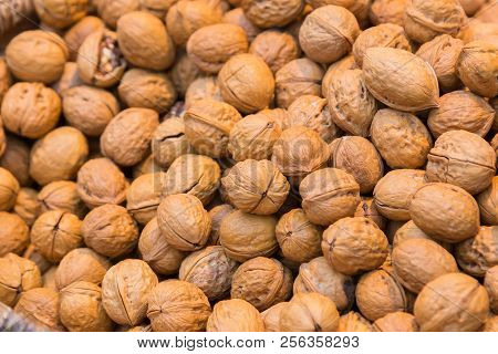 Pile Of Whole Salted Walnut With Sheel