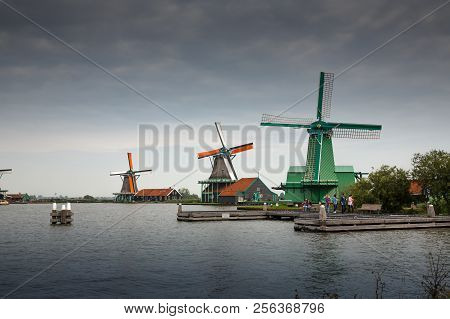 Zaanse Schans, Netherlands, August 19, 2015 - Traditional, Authentic Dutch Windmills At The River Za