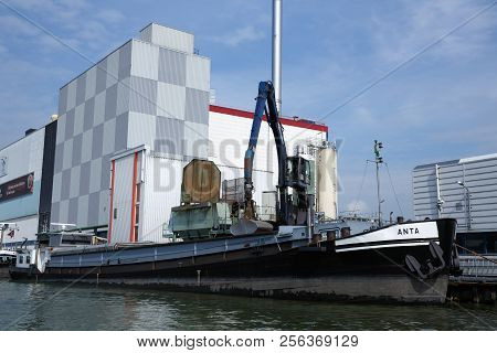 Zaanse Schans, Netherlands, August 19, 2015 - Industrial Area With Old Building, Boat And Crane.