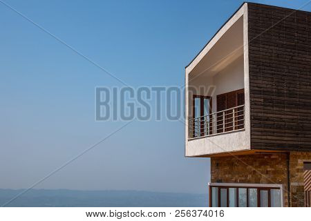 Side View Of One Modern Penthouse Apartmen With Large Balcony. Blue Sky And Horizon In The Backgroun