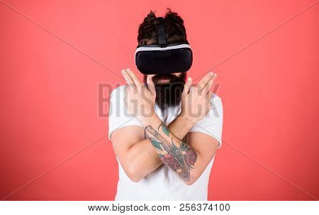 Man Bearded Hipster With Virtual Reality Headset On Red Background. Shooting Gallery Vr. Man Hand Ge