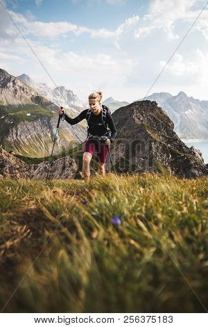 Adventurous Sportive Girl Hiking In Beautiful Alpine Mountains