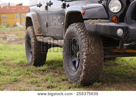 Copenhagen, Denmark - September 1, 2018: Close Up Of Dirty Jeep Wrangler After Driving Heavy Off-roa