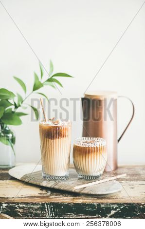 Iced Coffee Drink In Tall Glasses On Wooden Table
