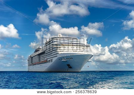 Cruise Ship In Crystal Blue Water With Blue Sky