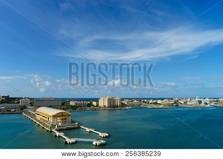 Scenic View Of Historic Colorful Puerto Rico City In Distance From The Sea With The Port In Foregrou