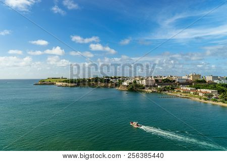 Scenic View Of Historic Colorful Puerto Rico City In Distance With Fort In Foreground