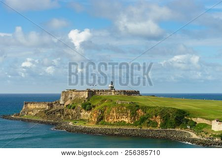 Scenic View Of Historic Colorful Puerto Rico City In Distance With Fort In Foreground