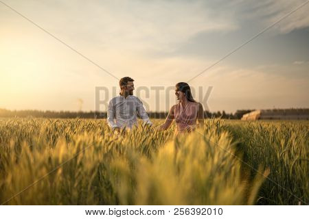 Romantic Couple on a Love Moment at gold wheat flied - Holambra, Sao Paulo, Brazil