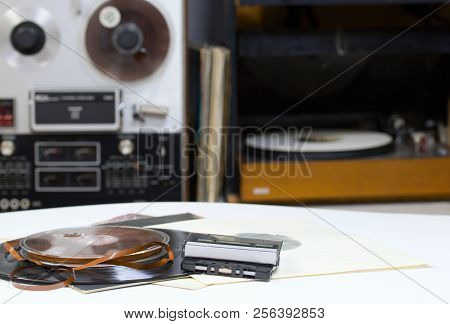 Vinyl Record With Copy Space In Front Of A Collection Albums Dummy Titles. Reel Tape Recorder. Audio