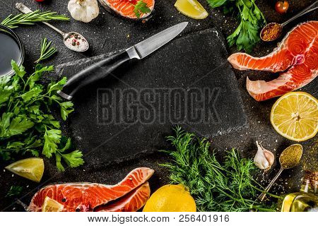 Raw Salmon Fish Steaks With Lemon, Herbs, Olive Oil, Ready For Grill, Slate Cutting Board, Dark Rust