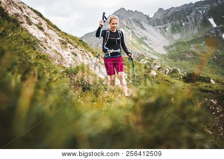 Adventurous Sportive Girl Hiking In Beautiful Alpine Mountains
