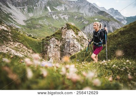 Adventurous Sportive Girl Hiking In Beautiful Alpine Mountains