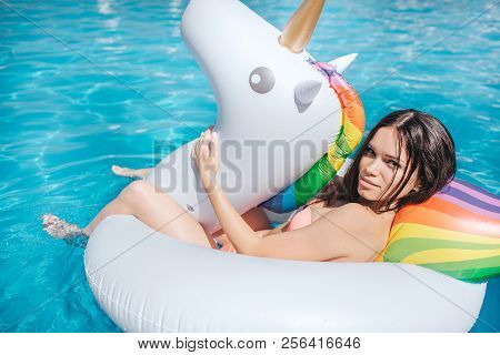 Sad And Angry Girl Is Lying On Mattress And Look On Camera. She Is Unhappy. Girl Sits On Air Mattres