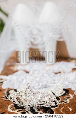 A Wedding Gentle Bouquet Of White And Pink Roses And High-heeled Shoes On A Green Grass In The Park.