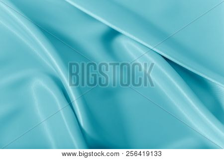 Smooth Elegant Shiny Turquoise Silk Or Satin Luxury Cloth Texture Can Use As Abstract Holidays Backg
