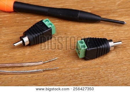 An Adapter That Converts The Terminal For Speaker Wire Into An Rca Type