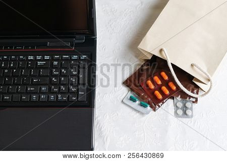 Medicines And Pills Next To Laptop, Notebook Keyboard. Stress In The Work, Anti Virus