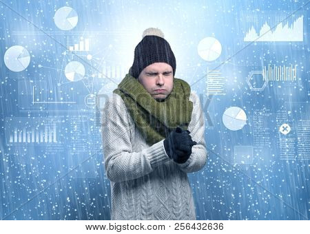 Young businessman shivering with graphs, reports and chart concept