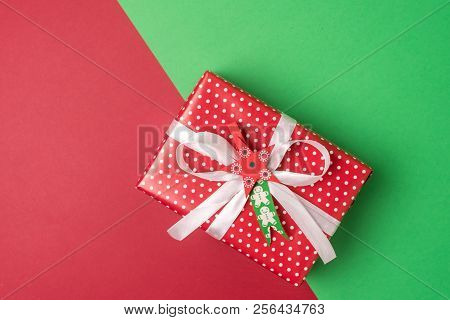 Christmas Present On A Red And Green Background Horizontal Copy Space Background With Gift Box Flat 