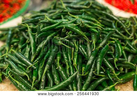 A Lot Of Green Chilies Background Close Up View, Market