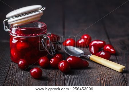 Ripe Red Cornel Berries Small Glass Jar Old Wooden Background Autumn Harvest Wild Berries