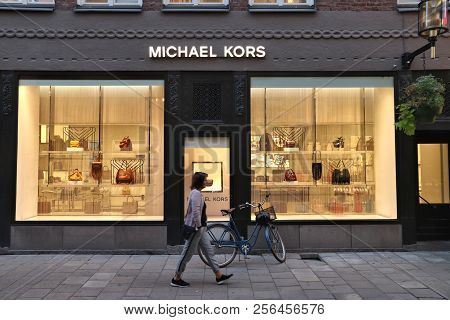 Stockholm, Sweden - August 22, 2018: Person Walks By Michael Kors Fashion Store In Stockholm, Sweden