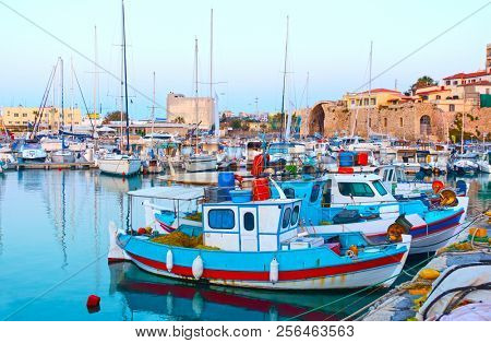 Old fishing boats in the port of Heraklion in the evening,  Crete, Greece