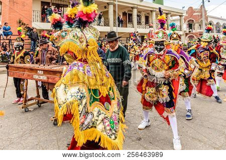 Parramos, Guatemala - December 28, 2016: Traditional Folk Dancers In Mask & Costume Perform Dance Of