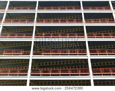 A Looking Upwards View Of Large Modern Commercial Building Under Construction With Steel Beams And G