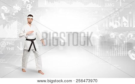 Young karate trainer doing karate tricks on the top of a metropolitan city