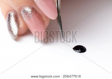 Closeup Eyelash Extension Tools Tweezers On White Background. Artificial Lashes Drop Of Glue.